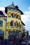 Albania / Shqiperia - Kor / Kora / Korce: yellow elegance - architecture - balconies with arches - photo by M.Torres