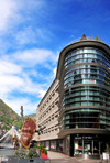 Andorra la Vella, Andorra: building housing Andorra1 FM radio and sculpture 'La noblesse du temps', Salvador Dal - Avinguda Meritxell, at Plaa de la Rotonda - Paris bridge in the background -  photo by M.Torres