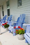 Canada 421 Victoria house showing porch and purple chairs in Acadian region of Nova Scotia, Canada - photo by D.Smith