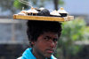 Fogo natural park, Fogo island - Cape Verde / Cabo Verde: boy selling lava handicraft - photo by E.Petitalot