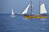 Barcelona, Catalonia: sailing boats pass in front of Barceloneta - photo by M.Torres