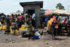 Goma, Nord-Kivu, Democratic Republic of the Congo: water distribution - women with jerrycans - photo by M.Torres