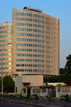 Brazzaville, Congo: building of the National Petroleum Company of the Congo, SNPC, Socit nationale des ptroles du Congo - golden light of the late afternoon - intersection of Avenue Adrien Conus and Avenue du Camp - photo by M.Torres