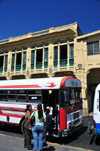 San Salvador, El Salvador, Central America: Parque Libertad - Portal 'la Dalia' and bus stop scene - photo by M.Torres