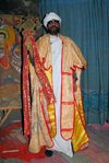 Lalibela, Amhara region, Ethiopia: Bet Maryam rock-hewn church - priest holding a cross - Ethiopian Orthodox Tewahedo Church - photo by M.Torres