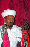 Lalibela, Amhara region, Ethiopia: Bet Giyorgis rock-hewn church - priest with crosses - UNESCO world heritage site - photo by M.Torres