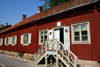 Turku, Western Finland province - Finland Proper region / Varsinais-Suomi - Finland: old pharmacy - entrance - typical Scandinavian houses along the Aura river - photo by A.Ferrari