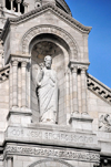 Paris, France: Sacr-Coeur Basilica / Basilica of the Sacred Heart - statue of Christ, showing his heart, by Gustave Michel - niche in the pediment of the Romano-Byzantine style faade - 'Rex', 'Cor Jesu Sacratissimum', 'Miserere nobis' - Montmartre district, 18e arrondissement - photo by M.Torres