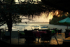 Rubane Island, Bijags Archipelago - UNESCO biosphere reserve, Bubaque sector, Bolama region, Guinea Bissau / Guin Bissau: Sunset, view of beach, palms, boats, beachfront restaurant at Hotel Punta Anchaca/ pr-do-sol, paisagem da praia, palmeiras, barcos, esplanada do Hotel Punta Anchaca- photo by R.V.Lopes