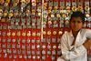 Bundi, Rajasthan, India: boy selling padlocks - photo by M.Wright