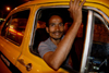 Calcutta / Kolkata, West Bengal, India: taxi driver waiting in Chowringhee - nocturnal - photo by G.Koelman