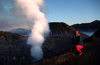 Mt. Bromo volcano, Java, Indonesia: smoking caldera - crater and climber at sunrise - Gunung Bromo - active volcano - Tengger massif - photo by S.Egeberg