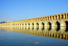 Isfahan / Esfahan - Iran: Sio-Seh Pol bridge over the Zayandeh River - the Bridge of 33 Arches or Allah-Verdi Khan - Safavid bridge design - commissioned by Shah Abbas I - photo by N.Mahmudova