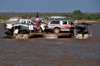 Belo sur Tsiribihina, Menabe Region, Toliara Province, Madagascar: trimaran ferry loaded with 4WDs crosses the Tsiribihina river - aft view - photo by M.Torres