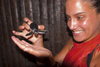 Sipadan Island, Sabah, Borneo, Malaysia: girl holding baby turtle in ranger station - photo by S.Egeberg