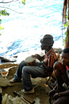 Nkhata Bay, Lake Nyasa, Northern region, Malawi: drummer by the water - photo by D.Davie