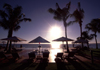 Pemba / Porto Amlia, Cabo Delgado, Mozambique / Moambique: Pemba Beach hotel and spa - parasols, palm trees, deck chairs and whirlpool, set against the sun and Pemba bay - tropical scene / chapus de sol, cadeiras de piscina e jacuzzi contra o sol a a baa - induglence - photo by F.Rigaud