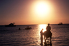 Mozambique / Moambique - Bazaruto: horse riding on the beach - sunset over the Indian ocean / passeio a cavalo na praia - photo by F.Rigaud