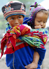 Nepal - Langtang region - old sister carring her young brother - photo by E.Petitalot