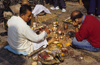 Kathmandu valley, Nepal: Swayambhunath temple - men performing puja - prasad - offers - photo by W.Allgwer