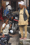 Patan, Lalitpur District, Bagmati Zone, Nepal: old traditional man and young modern boy - photo by J.Pemberton