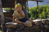 Annapurna area, Nepal: child on a stone wall - photo by W.Allgwer