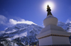 Annapurna area, Nepal: chorten, sun and Annapurna massif - photo by W.Allgwer