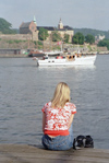 Norway / Norge - Oslo: girl looking at the Akershus fortress (photo by Juraj Kaman)