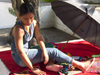 Panama City: a Kuna woman arranges her wares for the tourists - Paseo Las Bovedas, Casco Viejo - photo by H.Olarte