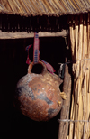 Lake Titicaca, Puno region, Peru: water vessel hangs from a reed house on the floating islands - photo by C.Lovell