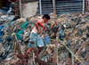 Manila city, Philippines - woman carrying water - Slums and shanty towns - photo by B.Henry