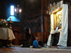 Trgu Neamt area, Neamt county, Moldavia, Romania: prayer in Neamt Monastery - mother and child in front of icon of the Virgin and baby Jesus - photo by J.Kaman