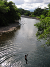 I Grande river / rio I Grande, Cau district, So Tom and Prcipe / STP: boy jumps from the bridge on the RN2 road / rapaz salta da ponte na EN2 - photo by M.Torres