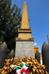 Tuili, Medio Campidano province, Sardinia / Sardegna / Sardigna: obelisk, crown of laurels and artillery shells - the Fatherland pays homage to the young men lost at war - square on Via Roma - photo by M.Torres