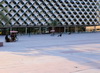 Riyadh, Saudi Arabia: facade with sails of King Fahad National Library (KFNL) and the nearby square - designed by Gerber Architekten, Al Olaya - photo by M.Torres