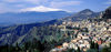 Sicily - Taormina: the town and the Etna volcano covered in snow - seen from Naxos - photo by W.Allgower