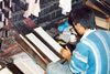 Sikkim - Gangtok: making wood block prints of Buddhist texts - photo by G.Frysinger