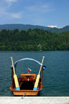 Slovenia - Pletna moored on Lake Bled - pletnas are made by thr skilled boat carpenters from the village of Mlino - the name comes from a German word Pleten - photo by I.Middleton