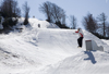 Slovenia - Snowboarder on Vogel mountain in Bohinj - jump - photo by I.Middleton