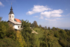 Slovenia - Jance: hilltop church and clouds - photo by I.Middleton