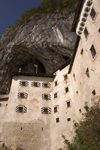 Predjama castle - wedged tight into a crevasse halfway up a 123-metre cliff-face , Slovenia - photo by I.Middleton