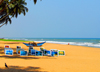 Wadduwa, Western province, Sri Lanka: painting and outrigger canoe on the beach - Blue Water Hotel - photo by M.Torres