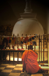 Kandy, Central Province, Sri Lanka: monk in front of stupa, Temple of the Tooth - photo by B.Cain