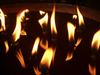 Tibet - Lhasa: Jokhang Temple - flames - butter lamps - photo by M.Samper