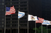 Chicago, Illinois, USA: USA, Chicago and Illinois State flags proudly fly on the Michigan Street Bridge - photo by C.Lovell