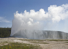 Yellowstone National Park, Wyoming, USA: Old Faithful Geyser erupts hourly, sending as much as 8,400 gallons of boiling water 185 feet into the air - photo by C.Lovell