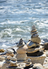 Narragansett Pier, Washington County, Rhode Island, USA: goup of cairns along Ocean road - balancing rocks with the Atlantic ocean as background - photo by M.Torres