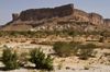 Wadi Hadhramaut, Hadhramaut Governorate, Yemen:  traditional village set under the Wadi cliffs - mesa and dry river bed - photo by J.Pemberton