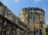 Stone Town, Zanzibar, Tanzania: Old fort - cylindrical tower and defensive wall - the Arab fort was adapted from the Portuguese citadel - Ngome Kongwe - photo by M.Torres