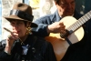 Argentina - Buenos Aires: smoking Tanguera and musician - San Telmo - Sunday at Plaza Dorrego (photo by N.Cabana)